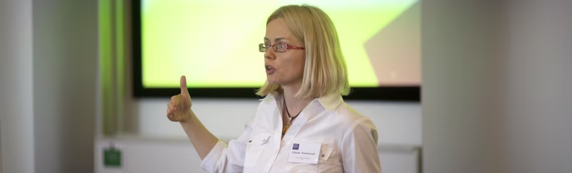 Olenka Kacperczyk speaking at a lecture