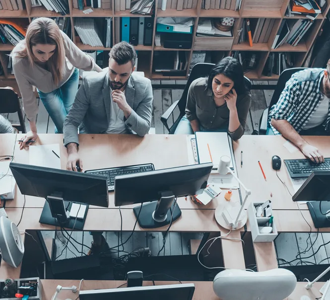 Group gathered at an office desk