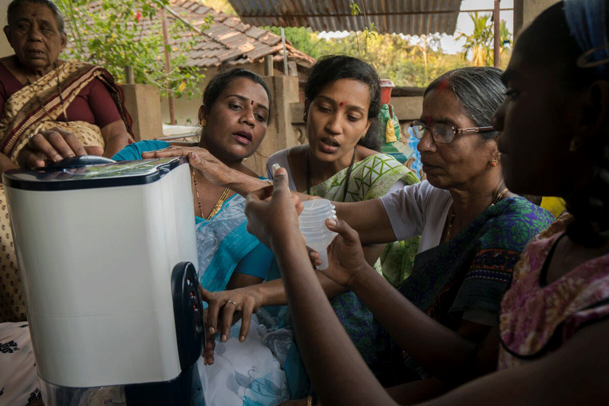 women-filling-water-1200x800
