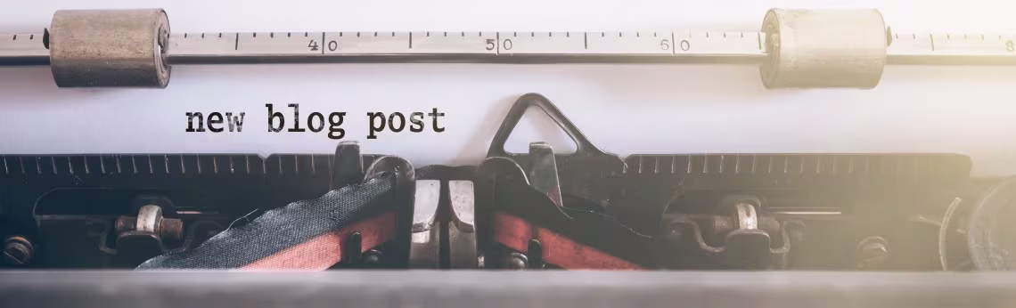 Picture of a typewriter with the words new blog post typed